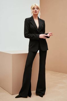 2-piece Womens Blazer Trouser Suit for office, business meetings, formal events and special occasions. Also perfectly combines with sneakers so after a long and tiring business day you can change you heels to sneakers and still look chic. DETAILS - flared pants with slits - pants inseam 36,6 inches or 93 cm - total pants length is 47,2 in or 120 cm - slim fit - high rise - blazer is buttoned - blazer length is 27,5 in or 70cm - sleeve length is 25,6 in or 65 cm - single Breasted - lined - side p Solid Long Sleeve Suits For Office Wear, Tailored Professional Pantsuit For Semi-formal Occasions, Solid Color Long Sleeve Suits For Office, Long Sleeve Office Lady Pantsuit For Work, Office Lady Long Sleeve Pantsuit For Workwear, Office Lady Pantsuit With Suit Collar, Office Lady Long Sleeve Pantsuit, Black Formal Office Lady Suit, Black Office Lady Suit For Formal Events