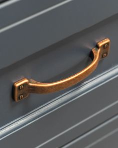 a close up of a metal handle on a drawer