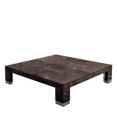 a square coffee table with an artistic design on the top and metal legs, against a white background