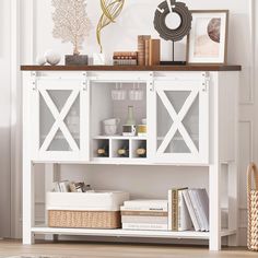 a white bookcase with open doors and baskets on the bottom shelf next to it