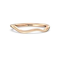 a gold ring with the word w o on it's front and back side