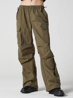 Composition : nylon 100%Color : Khaki Country of Origin : Vietnam Khaki Techwear Parachute Pants With Cargo Pockets, Techwear Khaki Parachute Pants With Cargo Pockets, Utility Outdoor Parachute Pants In Cargo Style, Khaki Military Style Parachute Pants, Techwear Nylon Parachute Pants With Cargo Pockets, Baggy Khaki Parachute Cargo Pants, Baggy Khaki Cargo Parachute Pants, Utility Nylon Cargo Pants, Utility Nylon Parachute Pants With Cargo Pockets