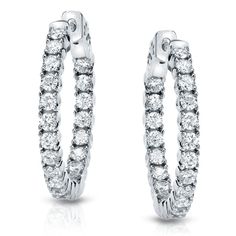 This delicate hoop earrings showcase 50 round-cut brilliant white natural diamonds in classic 4-prong setting. It is available in your choice of 14k white gold and secures with a Clip in clasp. Diamond Hoop Earrings Small, Gold Diamond Hoop Earrings, Jewelry Staples, Diamond Birthstone, Birthstone Gifts, Latest Jewellery, Diamond Hoop Earrings, Hoop Earrings Small, Diamond Jewellery