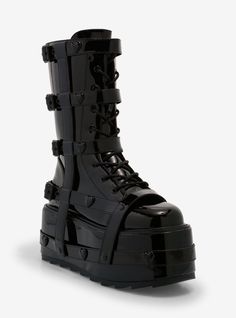 These are some serious boots. They have a large black patent platform and the uppers are decorated with black patent harnesses with heart-shaped grommets and black buckles. The front has lace-up detail and there's a zipper on the back for ease.Listed in women's sizes.Platform: 3 13"Polyurethane upper; rubber soleImported Black Punk Patent Leather Platform Boots, Punk Patent Leather Platform Boots, Punk Style Patent Leather Platform Boots, Black Leather Emo Platform Boots, Emo Black Leather Platform Boots, Black Platform Boots With Lug Sole For Alternative Fashion, Gothic Black Platform Boots With Studded Outsoles, Black Gothic Platform Boots With Studded Outsoles, Black High-top Patent Leather Platform Boots