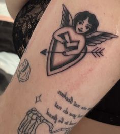 a girl with an arrow and heart tattoo on her arm