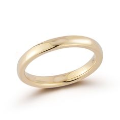 a gold wedding ring on a white background