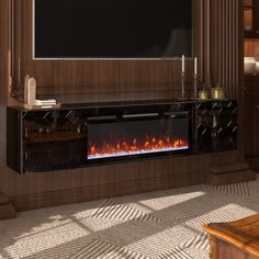 a living room with a large television mounted on the wall and a fire place in front of it