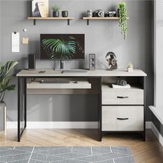 a desk with a computer on it and some plants in the corner next to it