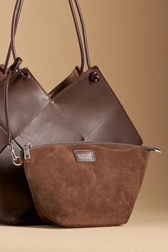 Leather Removable top zip pouch Tie closure Imported | Taylor Contexture Leather Bag by Bob Oré in Brown, Women's at Anthropologie Designer Leather Top Handle Pouch, Brown Top Handle Pouch For Shopping, Designer Leather Shoulder Pouch, Rectangular Leather Pouch For Shopping, Modern Leather Clutch Bucket Bag, Leather Clutch Pouch For Shopping, Luxury Hobo Bag For Shopping, Leather Shoulder Bucket Bag With Zipper, Versatile Pouch Bucket Bag With Zipper Closure