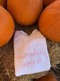 Stay cozy in this cute, fall inspired Pumpkin Spice monogrammed crew neck sweatshirt. Perfect for chilly walks to class or lounging in your favorite coffee shop. Dress it up with a statement necklace or layer your favorite vest over top. - 50/50 Preshrunk Cotton/polyester - Ribbed cuffs and waistband - Double-needle stitching at shoulders, armholes, neck, waistband and cuffs - Classic fit / Unisex fit Orange thread is used for embroidery. All sales are final due to customization of product. Will Multicolor Embroidered Text Sweatshirt For Fall, Embroidered Text Sweatshirt For Fall, Fall Sweatshirt With Embroidered Text, Pumpkin Patchwork Sweatshirt, Pumpkin Spice Sweatshirt, Monogram Sweater, Covington Ky, Shop Dress, Womens Sweatshirts