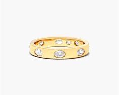 14K Yellow Gold Bezel Set Oval Diamond Ring. The smoothness of the metal is highlighted by the sparkle of the diamonds. Wear it alone or up the sparkle by pairing it with multiple stackable rings. Luxury Oval Stackable Rings, Luxury Oval Diamond Stackable Rings, Timeless Oval Stackable Diamond Ring, Timeless Oval Diamond Stackable Ring, Luxury Oval Stackable Diamond Ring, Oval Stackable Rings With Diamond Accents For Anniversary, Gold Oval Diamond Stackable Rings, Oval Gold Diamond Stackable Rings, Modern Oval Diamond Stackable Rings