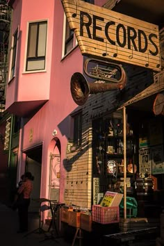 a pink building with a sign that says records on it