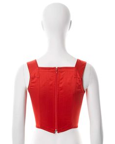 For Sale on 1stDibs - ▪ Vivienne Westwood corset ▪ Sold by One of a Kind Archive ▪ c. 1990s ▪ Constructed from red stretch-satin ▪ Built-in corset boning ▪ Embroidered orb ▪ Red Sleeveless Boned Bodice Corset, Red Corset With Corset Back For Summer, Red Summer Corset With Corset Back, Red Sleeveless Corset With Boning, Red Underbust Corset For Summer, Fitted Red Corset With Boned Bodice, Fitted Red Corset With Boning, Red Fitted Underbust Corset Belt, Fitted Red Underbust Corset Belt