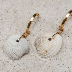 Easy, breezy, and a little bit beachy - the perfect earring when you want better than basics. ABOUT THE NAME Cortez Beach is one of the last remaining fishing villages on Florida's southwest Gulf coast. Just pull off the side of the road and take a quick walk through the tall trees and coastal grasses to the white sand beach. MATERIALS Cross-barred Venus shells on with 14k gold-filled hoops Every stone, shell, and handmade glass piece is unique, which means that each charm is too. You can expect Cheap Southwestern Beach Earrings, Cheap Beige Earrings For Beach, Cheap Bohemian Shell-shaped Earrings, Affordable Shell Earrings For Vacation, Cheap Artisan Earrings For The Beach, Unique Cheap Beach Earrings, Beach Artisan Earrings, Bohemian Nickel-free Hoop Earrings For Beach, Single Dangle Earring For Beach