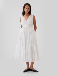 Soft pleated maxi dress.  V-neck, V-back.  Sleeveless.  Tie belt at waist.  Tiered skirt.  * Fit: Slim.  A fit & flare silhouette that sits close to the body & flares at the waist.  Hits at the ankle.  Model is approx.  5’10” wearing White Flowy Maxi Dress, Plus Size Sundress, Simple White Dress, Flowy Romper, Fisherman Pants, Church Dress, White Gown, Hannah Montana, Dresses Xxl