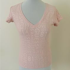 This Guess Women's Basic T-Shirt In Size S Features A V-Neckline And Short Standard Sleeves. Made Of A Cotton And Elastane Jersey Fabric, This Top Is Easy To Care For And Suitable For All Seasons. The Pink Color And Letter Pattern Make It A Great Choice For Casual Occasions. With A Pullover Closure, This Top Is Perfect For Those Who Prefer A Regular Fit. It's A Brand New Item Without Tags And Has Not Been Worn Before. Made In Guatemala, This T-Shirt Is A Must-Have For Women Who Love Comfortable Casual V-neck Tops With Text Print, Pink V-neck Graphic Tee Top, Pink V-neck Graphic Tee, Fitted V-neck Tops With Letter Print, Fitted V-neck Top With Letter Print, Shoes List, Sublimation Ideas Projects Inspiration, Personal Things, Sublimation Ideas