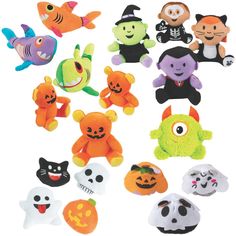 a bunch of stuffed animals that are on a white surface with different colors and shapes