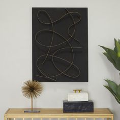 a painting on the wall above a console table