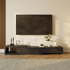 a flat screen tv mounted to the side of a wall in an empty living room