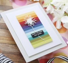 a card with a dandelion on it