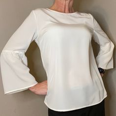 Banana Republic Ivory Blouse 3/4 Sleeves Medium 100% Polyester Elegant Solid Color Top With 3/4 Sleeves, Elegant Flowy Solid Color Blouse, Elegant Fitted Top With 3/4 Sleeves, Elegant Flowy Blouse, Chic Half-sleeve Spring Blouse, Elegant Solid Color Tops For Brunch, Chic Half Sleeve Spring Blouse, Elegant Flowy Solid Color Top, Elegant Blouse With 3/4 Blouson Sleeves