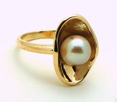 Golden Pearl Ring, Modern Yellow Gold Pearl Ring For Anniversary, Modern Yellow Gold Pearl Ring For Formal Occasions, Modern Round Pearl Ring In Yellow Gold, Oval Yellow Gold Pearl Ring With High Luster, Oval Pearl Ring In Yellow Gold With High Luster, Formal Yellow Gold Akoya Pearl Ring, Modern Gold Pearl Ring, Modern 14k Yellow Gold Pearl Ring