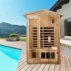 a wooden sauna next to a swimming pool