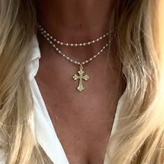 "This is made out of tiny cream glass pearls and has a little gold medal  cross with tiny beads, it is 30-33 inches long. You can also wear as a layered necklace The cross is almost 1 1/4\" long and 3/4\" wide" Beaded Necklace With Cross, Layer Cross Necklace, Cross Pearl Necklace, Pearl Necklace Layered, Wooden Cross Necklace, Long Cross Necklace, Beaded Cross Necklace, Layered Cross Necklace, Tiny Pearl Necklace