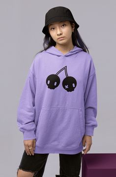 "Important Announcement!!  We will be overhauling our brand in the new year and many designs will be retired! Be sure to grab any favorites now before they are gone! Cute and creepy combined into one with this fruity pullover hoodie! Bring your alt style with our cherry skulls design, great for kawaii, pastel goth, colorful, or whatever fashion style you love. COLOR NOTES: Violet is a blue-purple shade. This hoodie is screenprinted on your choice of color unisex-style fleece hoodie. These are a Oversized Kawaii Hoodie For Streetwear, Casual Purple Sweatshirt With Cartoon Print, Kawaii Fall Sweatshirt For Streetwear, Kawaii Hoodie Sweatshirt For Streetwear, Oversized Kawaii Sweatshirt For Streetwear, Y2k Cotton Sweatshirt For Halloween, Kawaii Streetwear Hoodie, Kawaii Graphic Print Hoodie Top, Emo Cotton Hoodie For Halloween