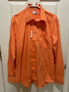 New Men’s Covona Long Sleeve Button Up Dress Shirt Spring Orange Large 16 36-37 EXACT ITEM IS PICTURED ABOVE. FREE SHIPPING IN THE 50 STATES! DELIVERY CONFIRMATION IS ALWAYS INCLUDED! WE SHIP ALL ITEMS WITHIN 1 BUSINESS DAY. WE DO NOT SHIP ON WEEKENDS OR HOLIDAYS WHEN THE POST OFFICE IS CLOSED. WE OFFER RETURNS ON MOST ITEMS. PLEASE VIEW OUR RETURN POLICY PRIOR TO PURCHASING. WE DO NOT CANCEL PURCHASES FOR ANY REASON  _gsrx_vers_795 (GS 7.0.7 (795)) Orange Button Up, Spring Dress Shirt With Buttons And Spread Collar, Solid Dress Shirt With Spread Collar For Spring, Spring Solid Color Dress Shirt With Spread Collar, Spring Solid Dress Shirt With Spread Collar, Solid Spring Dress Shirt With Spread Collar, Spring Collared Dress Shirt With Button Closure, Solid Collared Dress Shirt For Spring, Spring Solid Color Dress Shirt With Button Cuffs