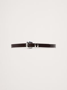 Designed and fitted to be worn on the hips, this skinny-width belt is crafted from a sturdy cut of leather and secured with a single buckle with beveled edges.  Single buckle closure.  Designed to be worn at the hips.  Designed to be worn at the hips.  Width: 1" (2. 5cm) XXS: 27-31" XS: 29-33" S: 31-35" M: 33-37" L: 36-40" XL: 40-44" XXL: 44-48" Adjustable Belt For Work, Adjustable Self Belt For Workwear, Beveled Edge, Leather Belt, Women's Accessories, Banana Republic, Dark Brown, Buckle, Leather