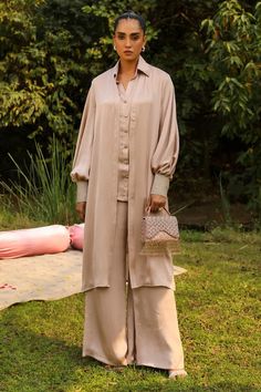 Beige front open shrug featuring bell sleeves. Paired with a detailed collared shirt and a straight flared pant. - Aza Fashions Chic Silk Pant Set With Long Sleeves, Sets With Blouson Long Sleeves, Eid Pant Set With Long Set-in Sleeves, Elegant Pant Set With Set-in Sleeves, Eid Workwear Palazzo Set With Long Sleeves, Chic Wide Leg Palazzo Set, Chic Long Sleeve Pant Set For Festive Occasions, Festive Chic Long Sleeve Pant Set, Formal Long Sleeve Palazzo Set