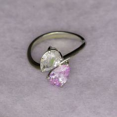 Our two stone pear engagement ring is also known as a "Toi et Moi" ring, which translates to "you & me"; a lovely sentiment for an engagement ring! The two stone ring style is very popular with quite a few celebrities choosing this style. Featuring lavender & white Cubic Zirconia pear shape stones and nickel free, recycled sterling silver. Contact us to personalize with any gemstone or birthstone.A very unique engagement ring for anyone looking for different! The style is modern, yet classic, wi Two Stone Ring, Simple Wedding Bands, Pear Engagement Ring, Ring Style, Unique Engagement, Recycled Sterling Silver, Simple Weddings, Unique Engagement Rings, Stone Ring