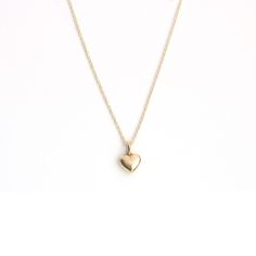 Capture hearts with our adorable 14 Karat solid gold puffy heart necklace. This charming piece is the perfect accessory to showcase your sweet and playful side. Crafted with love and attention to detail, it adds a touch of cuteness to any outfit and makes a delightful gift for yourself or a loved one. 11mm x 7.5mm *All our pieces are made to order and beautifully crafted specifically for you. Please confirm sizing before placing your order and allow 14-21 days from purchase to complete and ship Puffy Heart Necklace, Necklace Cute, Puffy Heart, 21 Days, Heart Pendant Necklace, Heart Necklace, Heart Pendant, Solid Gold, With Love