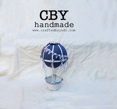 a helmet with writing on it and the words cby handmade written in cursive ink