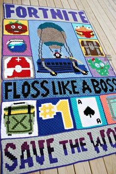 a crocheted rug that says floss like a boss save the world on it