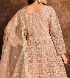 COLOR : Dusty Peach FABRIC : Top - Net, Bottom & Inner - Santoon, Dupatta - Net WORK : Heavy Silk Thread Embroidery, Lace BorderOCCASION : Wedding, Reception, Party Wear, Festival READY-TO-WEAR : NoSTITCHING : Available as semi-stitched fabric, can be stitched using standard size option (+$20). Note: There might be a slight color variation due to lighting and flash used during photoshoot. The bright shade seen is the best closer view of fabric's color. Net Anarkali, Silk Thread Embroidery, Wedding Reception Party, Top Net, Dusty Peach, Taupe Fabric, Light Mauve, Reception Party, Anarkali Suit