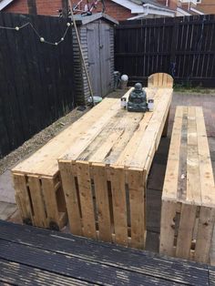 a wooden table and bench made out of pallets