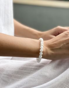 The moonstone bracelet for love is the perfect way to attract positive energy and loving vibes into your life. The beautiful beaded bracelet is made with natural moonstone gemstones, which have been believed to possess powerful healing properties for centuries. Wear the bracelet as a symbol of your own love and light, and enjoy the peace and serenity it brings you. Crystal Bracelet Photography, Elegant Crystal Bracelet With 8mm Beads, Elegant Adjustable Gemstone Beads Crystals, Delicate White Adjustable Crystal Bracelet, Hand-strung Moonstone Beaded Bracelets For Meditation, Handmade Elegant Rose Quartz Crystal Bracelet, Delicate White Crystal Bracelet Gift, Moonstone Gemstone Beads Bracelets For Meditation, White Gemstone Beaded Bracelets For Meditation