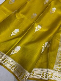 This is a very beautiful pure banarasi mashru silk handloom saree . All over kadhuwa weave and bootis. rich pallu with blouse piece.  Saree length - 5.5 mtr. Blouse - 1 mtr.  Dry clean only . Please note - color may be vary a little due to sunlight and photography . Please message us after purchasing in case you want fall and Pico done it not . No extra charges for fall and Pico but inform us . Blouse stitching is also available . Diwali Slub Silk Pre-draped Saree With Weaving Work, Slub Silk Saree With Weaving Work For Puja, Handloom Anarkali Dupatta In Paithani Silk, Navratri Slub Silk Saree With Weaving Work, Anarkali Paithani Silk Handloom Dupatta, Anarkali Handloom Paithani Silk Dupatta, Eid Handloom Banarasi Silk Saree, Gold Slub Silk Dupatta With Weaving Work, Yellow Saree With Weaving Work