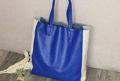 Overview:Design: Handmade Vintage Tote BagIn Stock: Made to order (4-7 days)Include: Tote + A detachable Side InnerCustom: NoColor: Blue&WhiteLeather: Head Layer Cowhide LicheeMeasures: 48cm /Bottom 37cm x 40cm x 11cmWeight: 0.75 kgSlots: 1 slotAccessories(option): NoStyle: Tote Bag, Shoulder bag, Handbag, Shopper bagVery durable (At least 5 Years) and it should last a life timeNote:Each item will have very slight variances to the pictured item, and the consequence is that you can assure that ea Color Block Tote Bag, Leather Bag Handmade, Overview Design, Color Block Tote, Needle Felting Tutorials, Handbag For Women, Felting Tutorials, Leather Bags Handmade, Genuine Leather Bags