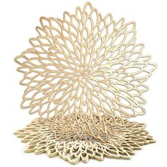 an intricately designed wooden sculpture on a white background