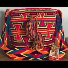 Handcrafted By Indigenous From The Guajira Colombiana, Each Bag Is Unique And The Time To Elaborated Is Between 20 To 30 Days. Casual Purple Satchel With Adjustable Strap, Casual Purple Crossbody Satchel, Casual Purple Rectangular Satchel, Pink Backpack For Vacation, Multicolor Rectangular Bucket Bag With Adjustable Strap, Multicolor Crochet Satchel Bag For Travel, Handmade Purple Shoulder Bag, Multicolor Bucket Satchel With Adjustable Strap, Colorful Crossbody Travel Bag