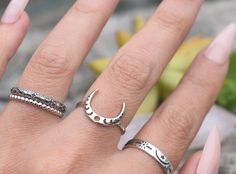 "Crescent Moon Phase Ring details: -Solid .925 sterling silver -12mm moon height, 2mm ring band -US size 4-10 Other moon rings shown here: https://www.etsy.com/shop/AWildViolet?ref=seller-platform-mcnav&search_query=moon+ring Looking for a last minute or unique Christmas gift? Visit our \"READY TO SHIP\" section here, ships out in one business day https://www.etsy.com/shop/AWildViolet?section_id=23587515 Connect with us on Instagram @a_wild_violet for sales and giveaways! **All items are in stoc Silver Midi Rings With Moon Phase, Bohemian Silver Ring With Moon Charm, Silver Moon Phase Midi Rings, Bohemian Silver Moon Charm Ring, Silver Moon Shaped Stackable Promise Rings, Silver Stackable Moon-shaped Rings For Promise, Silver Adjustable Moon Stackable Rings, Silver Crescent Midi Rings In Celestial Style, Moon Ring Silver