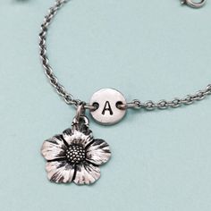 Flower charm bracelet with hand stamped initial. Bracelet size is 6 1/2 inches with 2 inch extender. If you need a larger size please message me. *Initial charm is antique silver pewter 9mm *Flower charm is antique silver pewter *Your purchase will arrive packaged in a cute gift box and I will include a message by request. Add on a birthstone charm for $3.00 https://www.etsy.com/listing/235600956 *Go back to Toodaughters https://www.etsy.com/shop/Toodaughters Personalized Silver Flower Bracelets, Personalized Silver Flower Bracelet, Silver Personalized Flower Bracelet, Flower Charm Bracelet, Bracelet Flower, Bracelet Initial, Personalized Bracelet, Cute Gift Boxes, Initial Bracelet