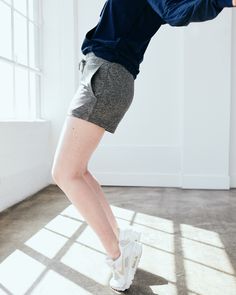 These are just about the coziest shorts you'll ever find, made from our signature Flowknit material. With a bit of stretch, they're designed to move with you - whether you're on a run, running errands, or not running at all. Our Flowknit is made from Global Recycle Standard poly yarn, which diverts and recycles plastics destined for landfill or the ocean, so you can feel and look good in what you wear.  | Quince | Women's Super Soft Performance Shorts in Heather Grey, Flowknit Activewear, Size X Mid Rise Shorts, Quince, Get Up, Running Errands, The Ocean, Heather Grey, Mid Rise, Active Wear, Size Medium