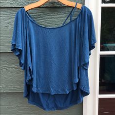 New With Tags, Free People Hi-Low Top With Batwing Short Sleeves, Size Medium. This Beautiful Blue Top Features Criss Cross Straps For An Off The Shoulder Look With Batwing Short Sleeves. Back Is Longer Than Front. Loose And Flowy. Blue Short Sleeve Summer Tops, Blue Flowy V-neck Top, Casual Blue Stretch Blouse, Blue Stretch Tops For Vacation, Blue Stretch Summer Tops, Blue Stretch Cotton Blouse, Light Blue Stretch Tops For Beach, Light Blue Stretch Top For Beach, Light Blue Stretch Top For The Beach