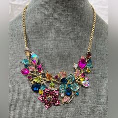 Nwotfashion Jewelry Ladys Necklace W/Crystals Brightly Colored Amazingly Beautiful. Measures Around 20” Adjustable. Very Formal And A Statement Piece Night On The Town. A Gorgeous Dressy Necklace. Ven.30never Worn Brand New. Multicolor Crystal Necklace With Rhinestones, Multicolor Rhinestone Necklace With Sparkling Stones For Party, Multicolor Crystal Necklaces For Parties, Multicolor Crystal Rhinestone Necklace With Sparkling Stones, Multicolor Crystal Rhinestone Costume Necklace, Multicolor Crystal Rhinestone Necklace, Elegant Multicolor Rhinestone Necklace With Bling, Jeweled Crystal Necklaces For Parties, Multicolor Rhinestone Necklace For Party