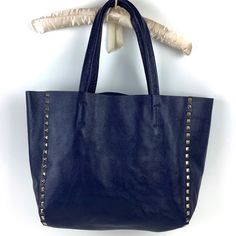 Dsj Danielle Stevens Vicenza Navy Blue Leather Tote Bag Nwot - Never Used Includes Dust Bag Double Handle, Navy Blue Tote Is Great For Every Day Wear And Is Spacious Enough To Carry Everything You Need. Includes An Easily Removable Leather Trimmed Liner That Snaps In And Out, And Can Be Washed If Necessary. Genuine Leather And Goldtone Stud Detailing On Front. Remarkable Silky Liner With Top Zipper Closure. 15” W X 11” H X 4 “ D 8 1/2 “ Strap Drop. Includes Original Dust Bag Chic Bag With Snap Closure For Errands, Elegant Blue Soft Leather Shoulder Bag, Blue Soft Leather Shoulder Bag, Chic Blue Bags For Shopping, Blue Bags With Removable Pouch For Errands, Blue Pouch Satchel For Shopping, Navy Bags With Gold-tone Hardware For Daily Use, Navy Leather Shoulder Bag With Gold-tone Hardware, Blue Soft Leather Bag With Double Handle