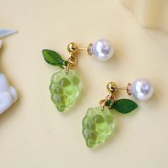 Vibrant Green Grape Design: These earrings feature a stunning green grape motif, perfect for adding a touch of nature to your style. Crystal Elegance: Adorned with sparkling crystals, these grape drop earrings offer a luxurious and eye-catching look. Playful Fruit Dangle: The fruit dangle design adds a fun and whimsical element to any outfit, making them a unique accessory. Versatile for Any Occasion: Ideal for everyday wear or special events, these earrings effortlessly enhance your ensemble. P Earrings Food, Grape Design, Green Grape, Grape Earrings, Glass Bead Earrings, Food Earrings, Green Grapes, Outfit Making, Colorful Jewelry